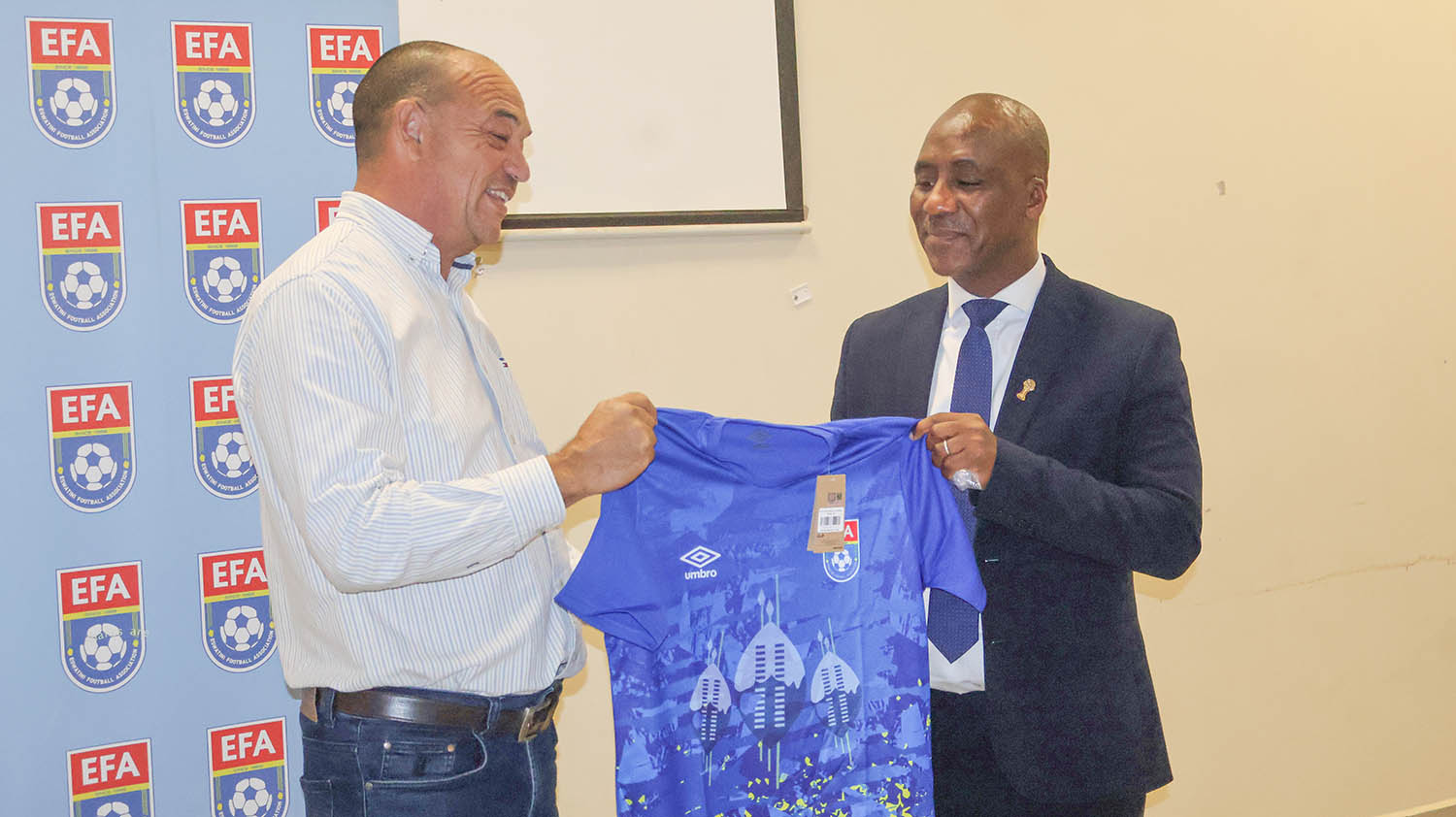 EFA Vice President Steve Horton (L) presenting Humphrey Thlobela with Sihlangu home kit as a token of appreciation.